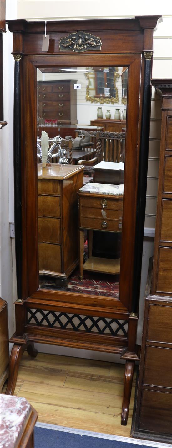 A carved cheval mirror W.72cm